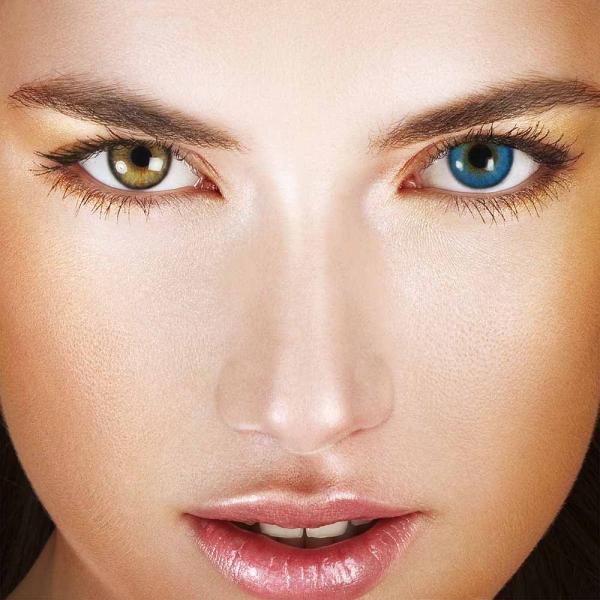 Model with colored contact lenses in one eye