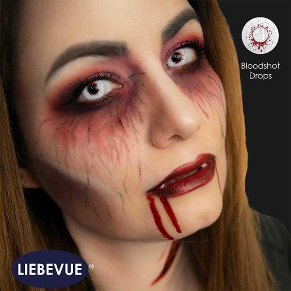 Model wears red and white contact lenses from LIEBEVUE - Funky Bloodshot Drops